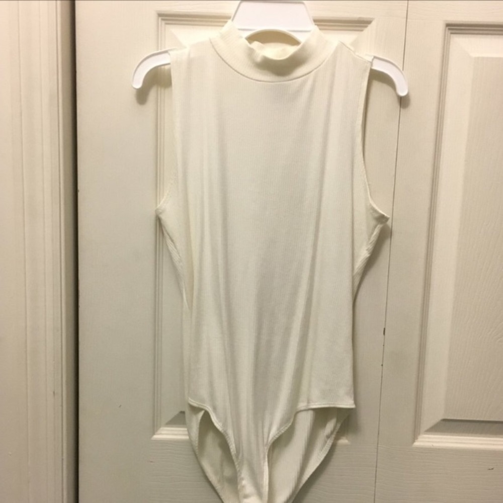 Mock neck white no sleeve bodysuit. Size large